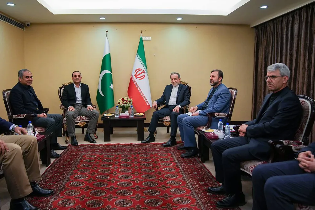 Iran's Foreign Minister Abbas Araghchi (C-R) welcoming Pakistan's Army Chief Asim Munir (C-L) in Tehran, on Wednsd on April 15, 2026.