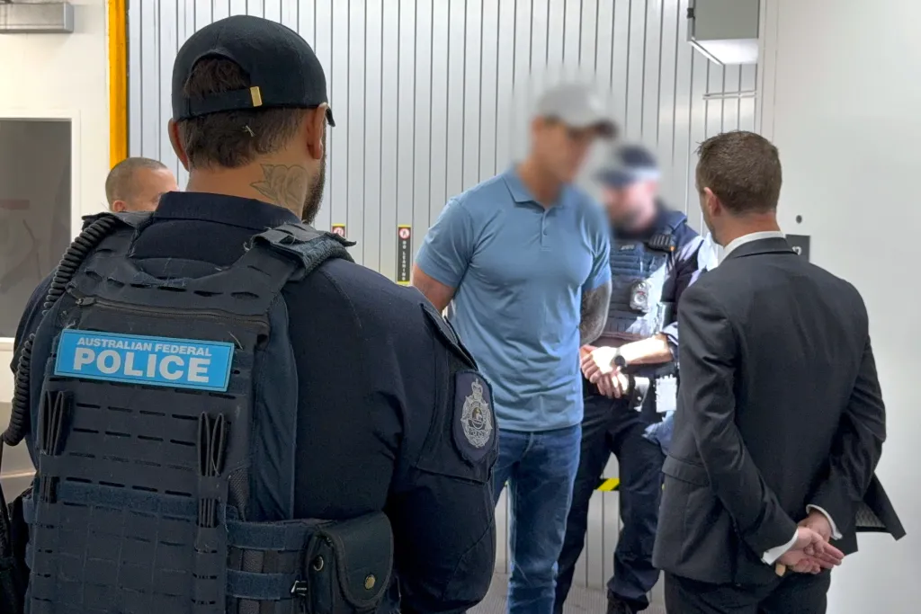This handout image taken and released on April 7, 2026 by the Australian Federal Police shows police arresting a 47-year-old former Australian soldier, who was widely named in local media as Victoria Cross recipient Ben Roberts-Smith, in Sydney.