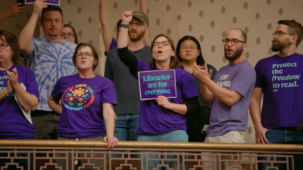 Advocates at a library board meeting in Tennessee protesting the removal of books.