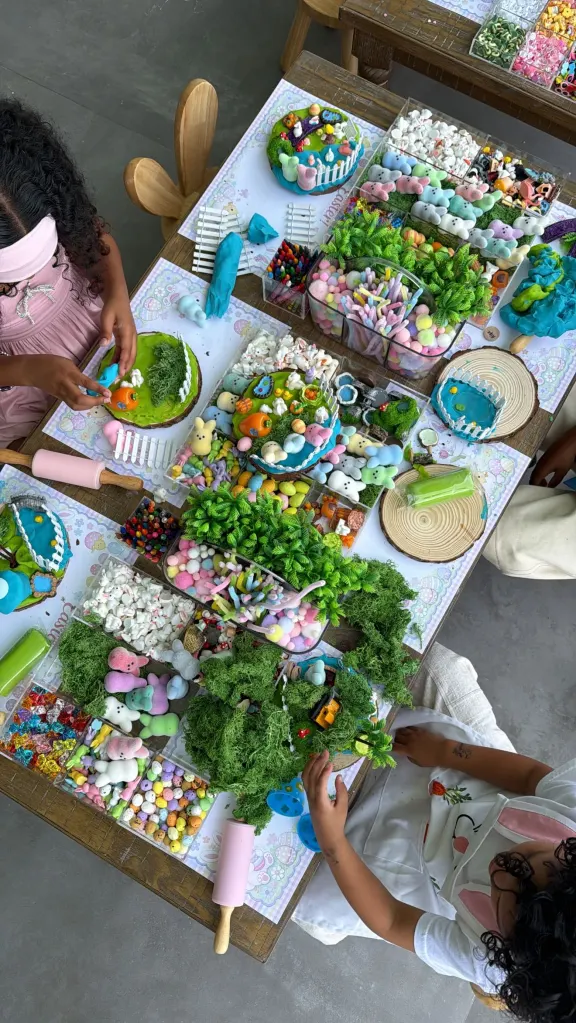 Two children crafting Easter decorations with colorful materials.