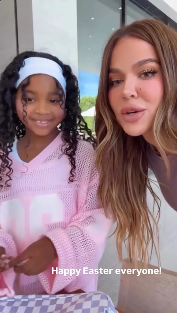 Khloe Kardashian and a child pose for an Easter photo.