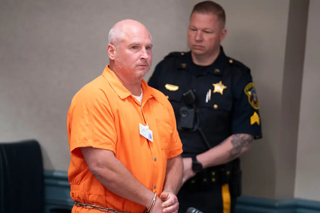 Robert William McCaffrey is escorted into court for his arraignment in Sussex County Courthouse on Monday, April 20, 2026, after being charged in connection to the 1990 murder of a woman. (