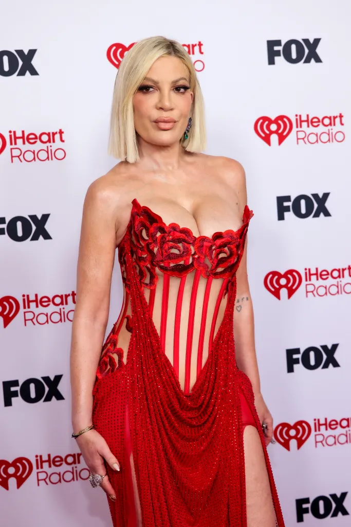 Tori Spelling on the red carpet at the iHeartRadio Music Awards.