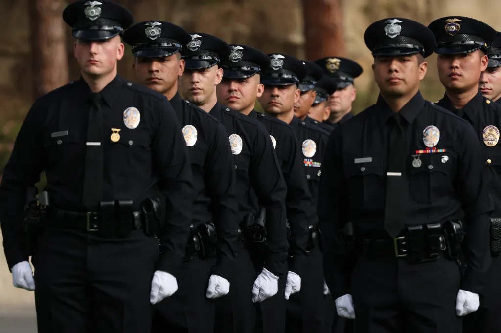 New Los Angeles Police Department recruits standing in formation during their graduation ceremony.