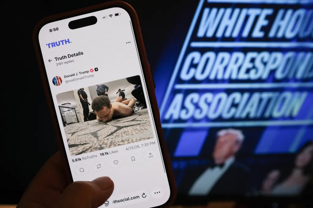 Illustration of a phone showing a Truth Social post by Donald Trump with an image of a suspect on the ground being apprehended.