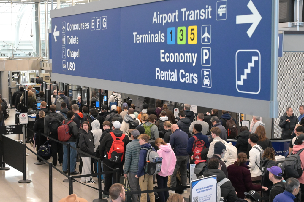 Travelers line up inside O'Hare International Airport in Chicago, Illinois, on March 16, 2026.