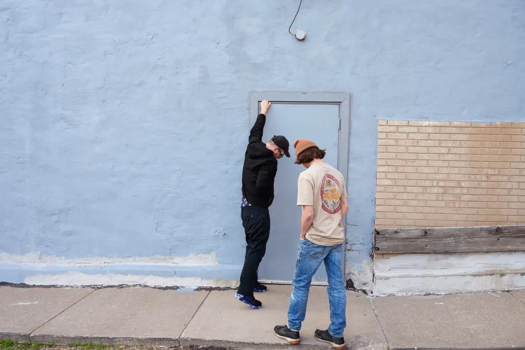 Two visitors checking the door of the Quality Learning Center, which was raided by the FBI.