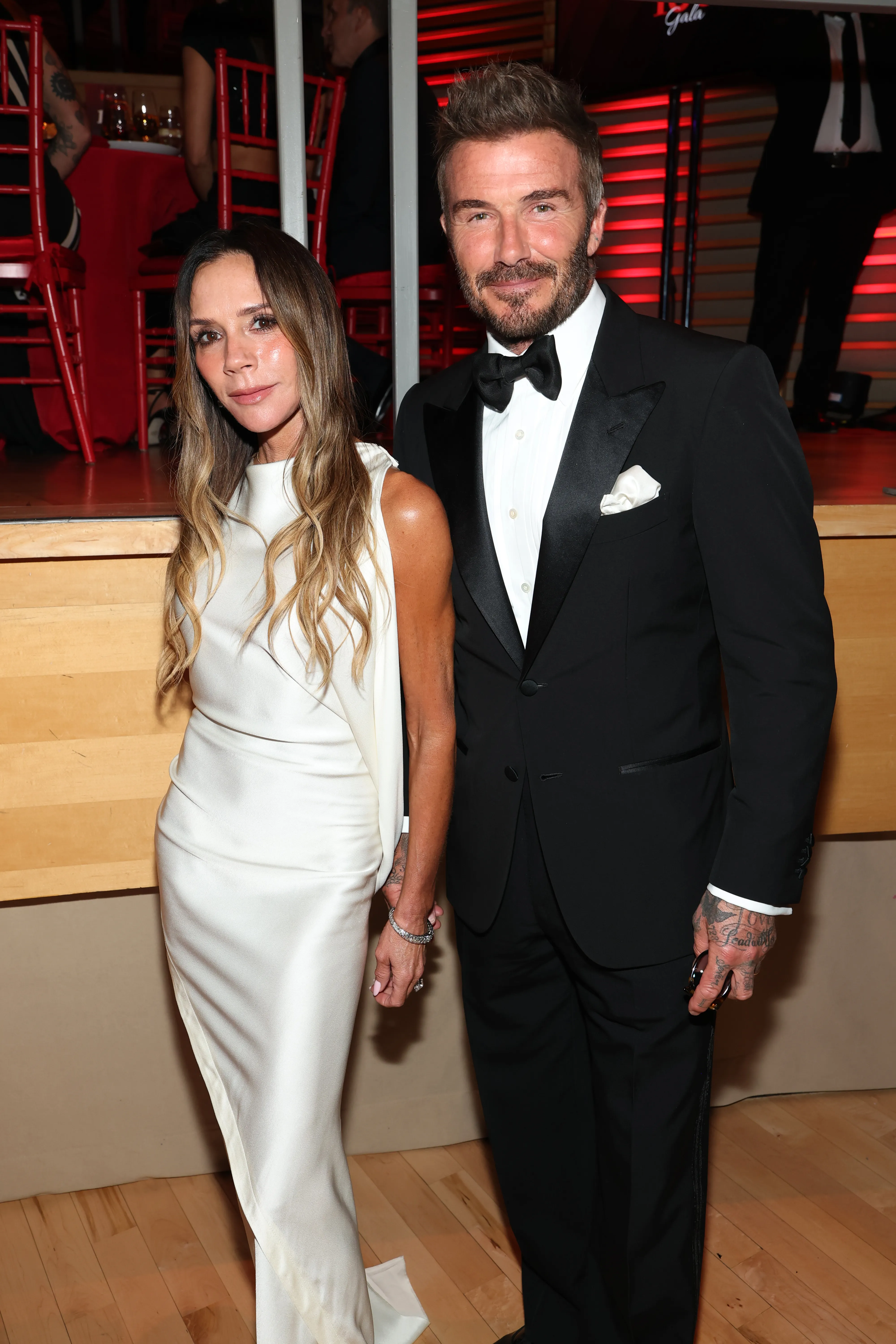 Victoria Beckham in a white dress and David Beckham in a black tuxedo at the 2026 TIME100 Gala.