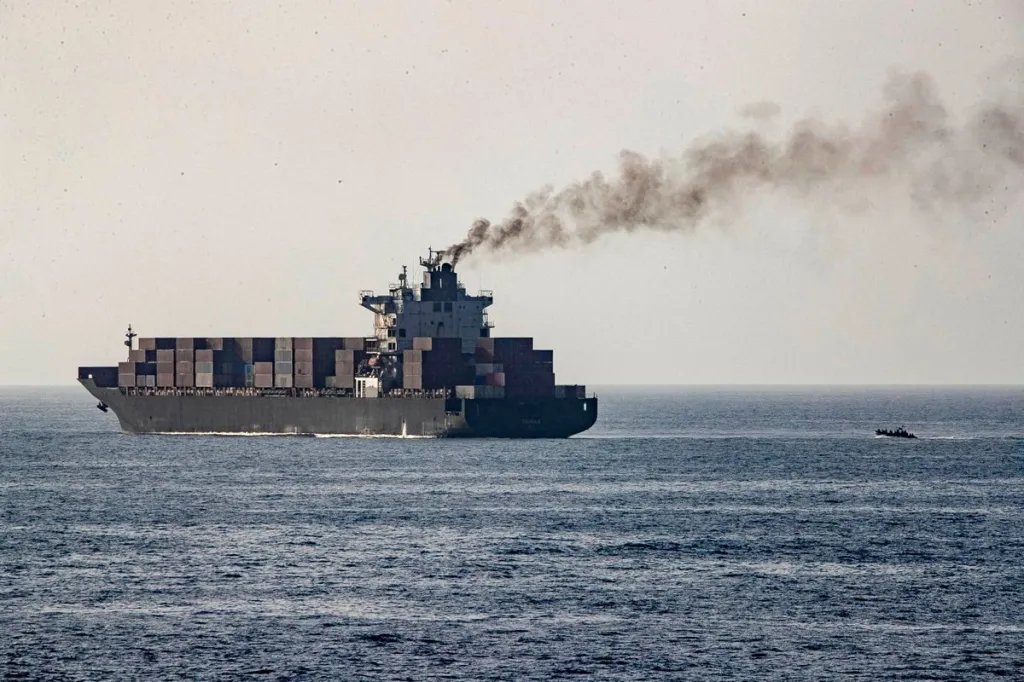 U.S. forces patrol near the Iranian-flagged cargo ship M/V Touska after it was boarded and seized by U.S. forces on Sunday.