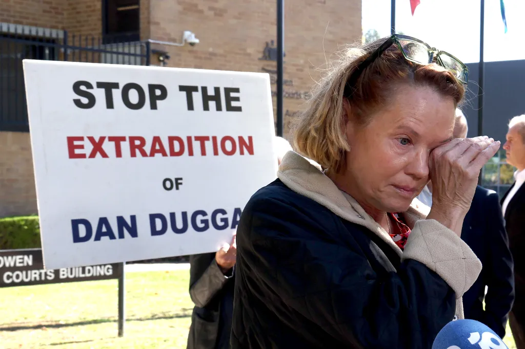 Saffrine Duggan, the wife of Daniel Duggan, reacts as she talks to the media outside the Federal Court of Australia in Canberra on April 16, 2026.