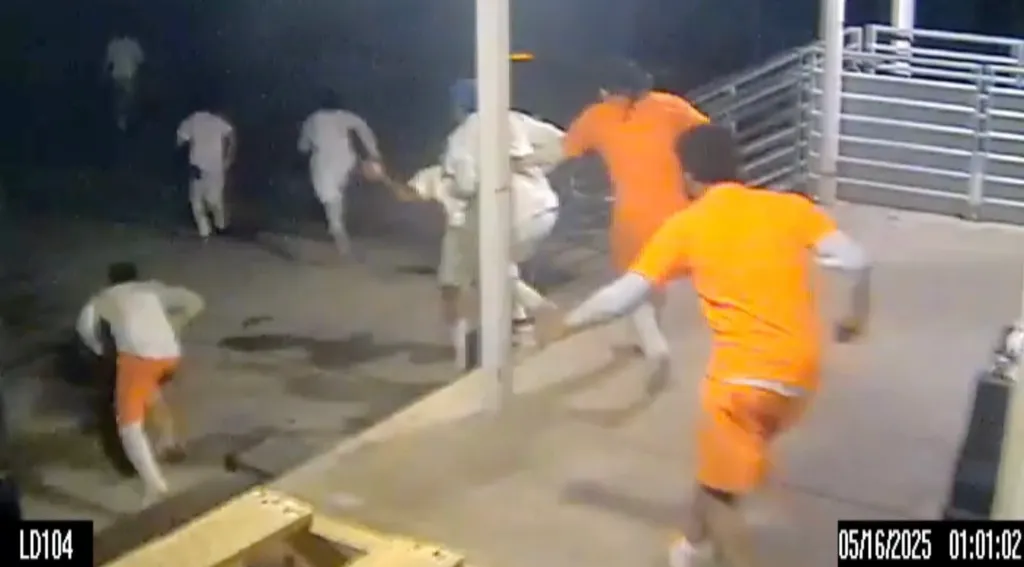 CCTV footage of inmates in orange and white outfits escaping.
