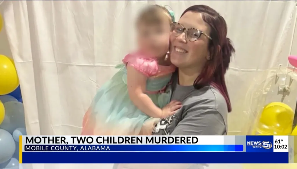 A smiling woman with glasses and dark red hair holds a blurred child in a light blue and pink dress. The text overlay reads, 