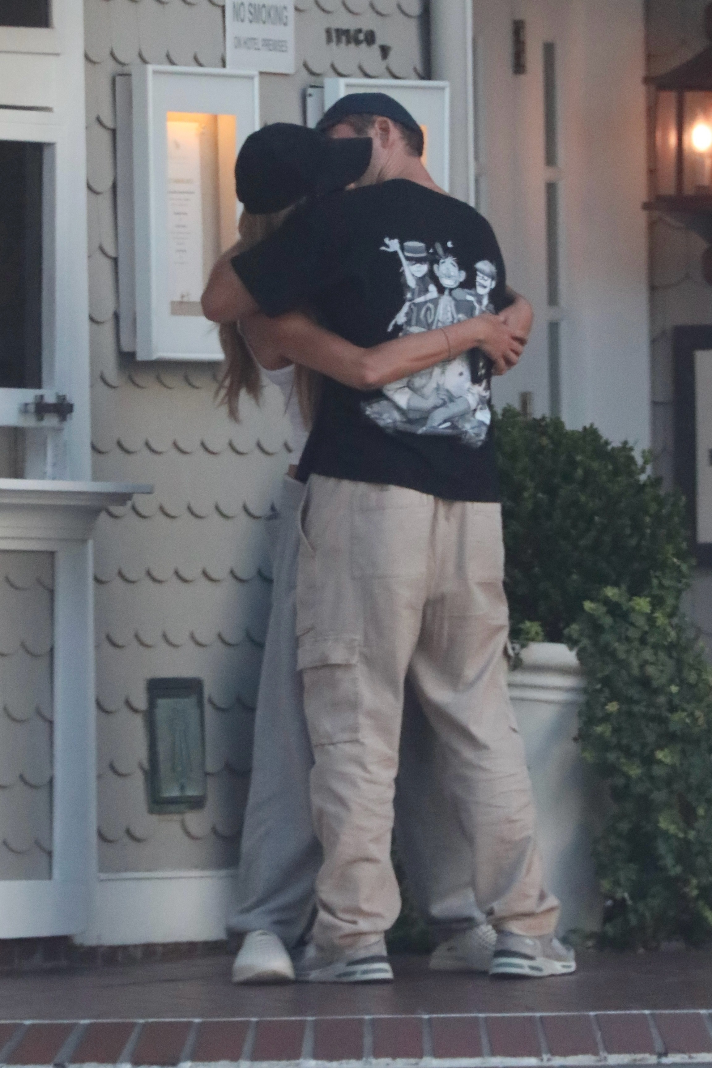 Brooks Nader and Taron Egerton sharing a passionate kiss in Santa Monica.