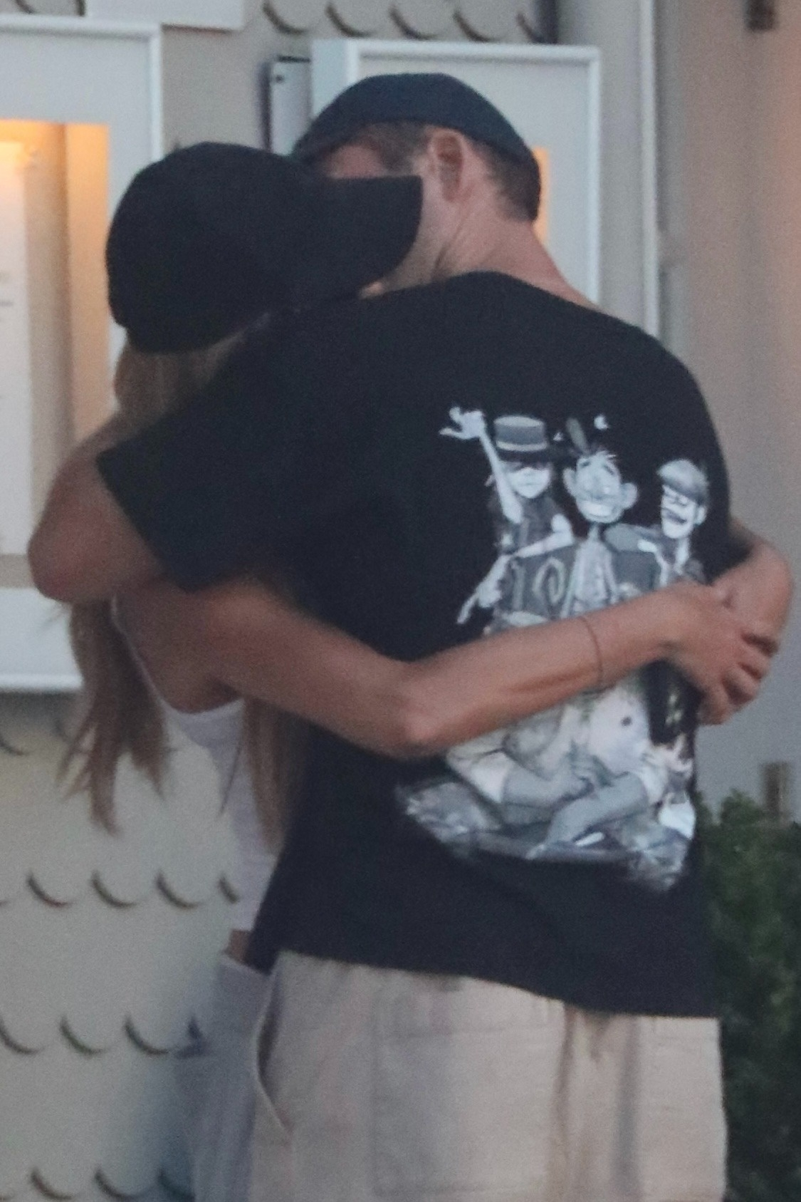 Brooks Nader and Taron Egerton sharing a passionate kiss in Santa Monica.