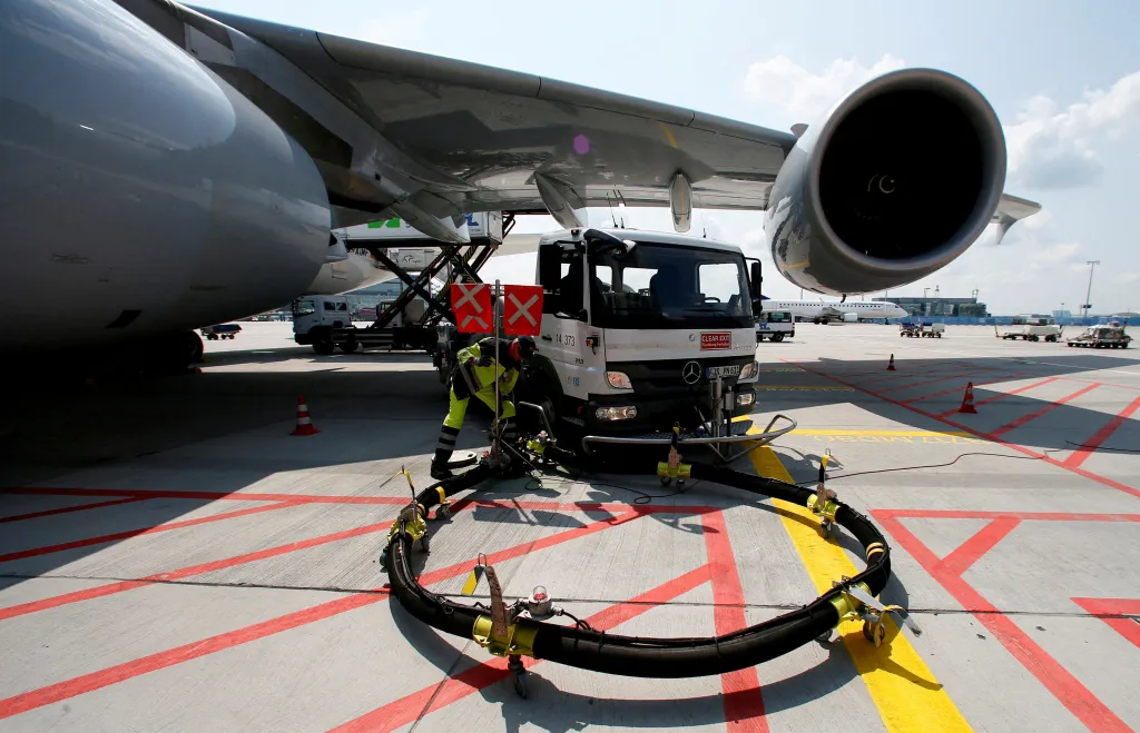 A ground crew worker refuels a Lufthansa Airbus A380 at Frankfurt airport.