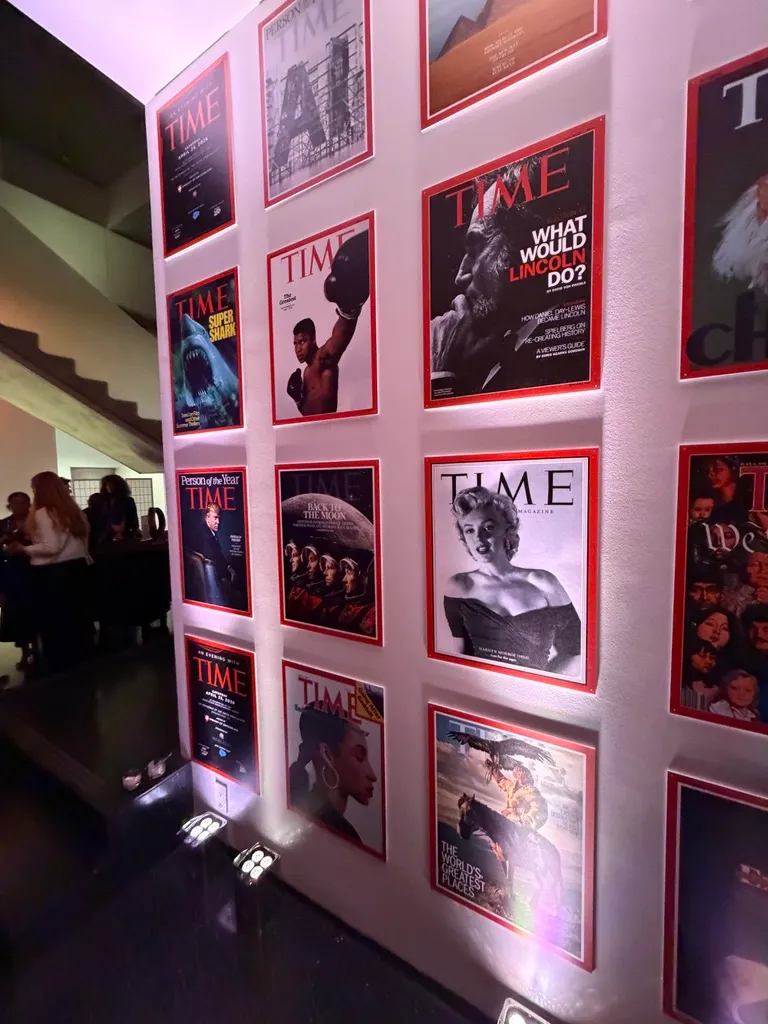 TIME magazine covers on display at a party.