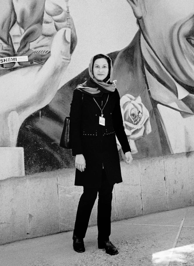 a photo of the author, clad in black, in Tehran in 2005