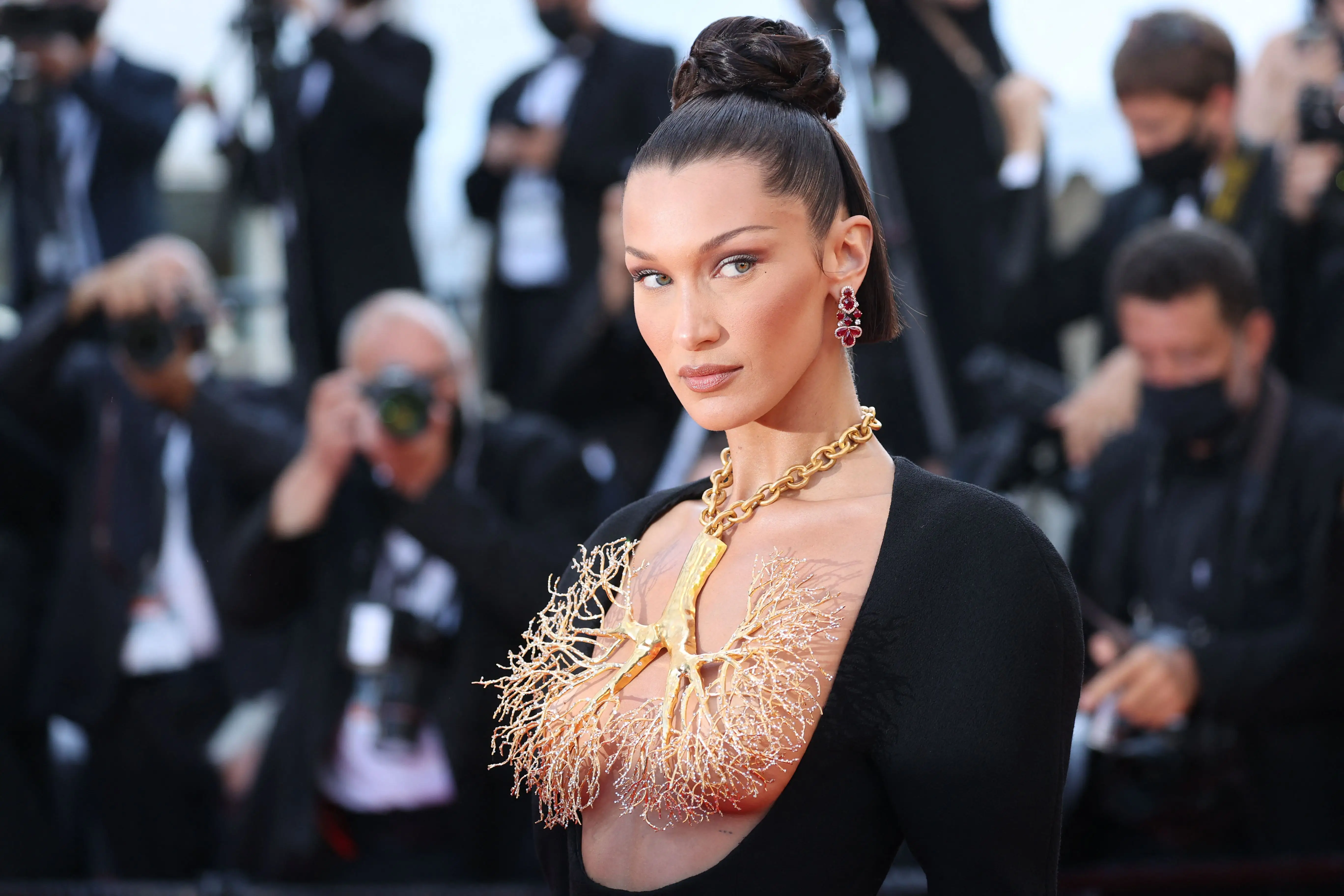 US model Bella Hadid poses as she arrives for the screening of the film 