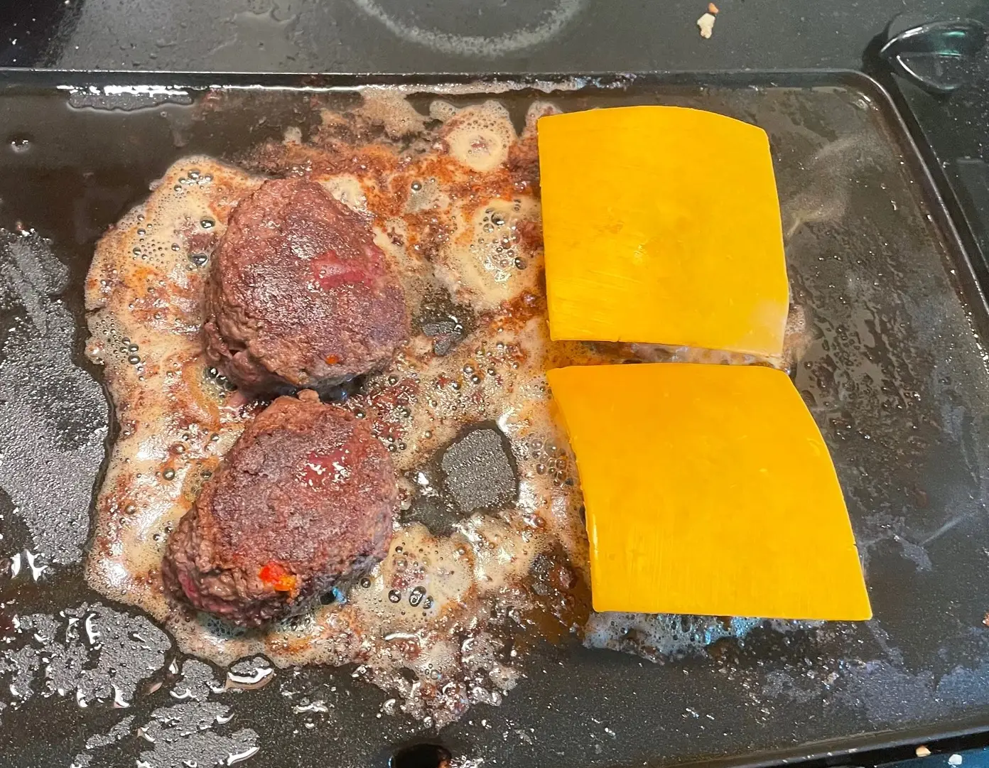 Melting cheese for Gordon Ramsay's Burger