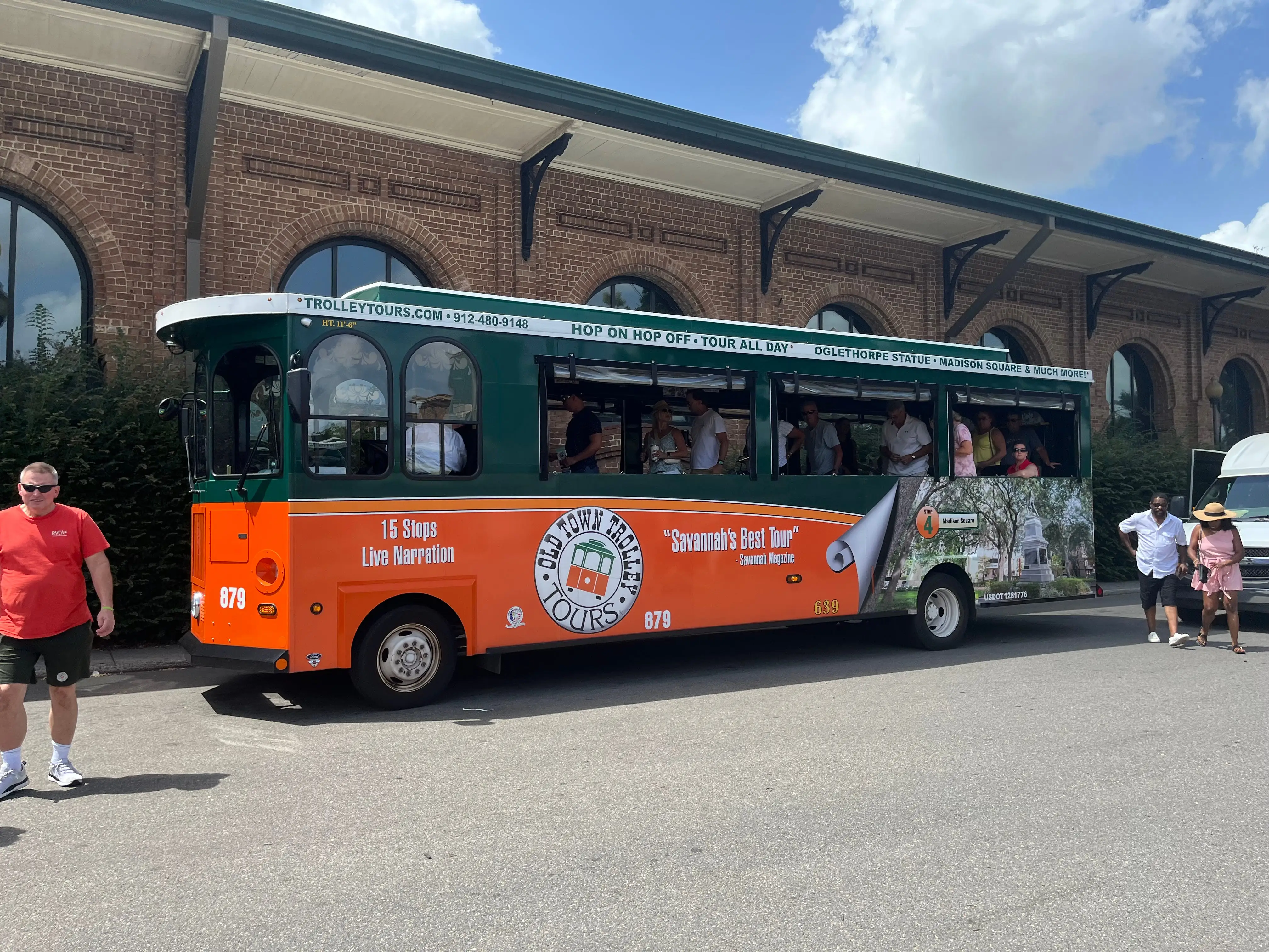 trolley parked in front of a building in savannah georgia