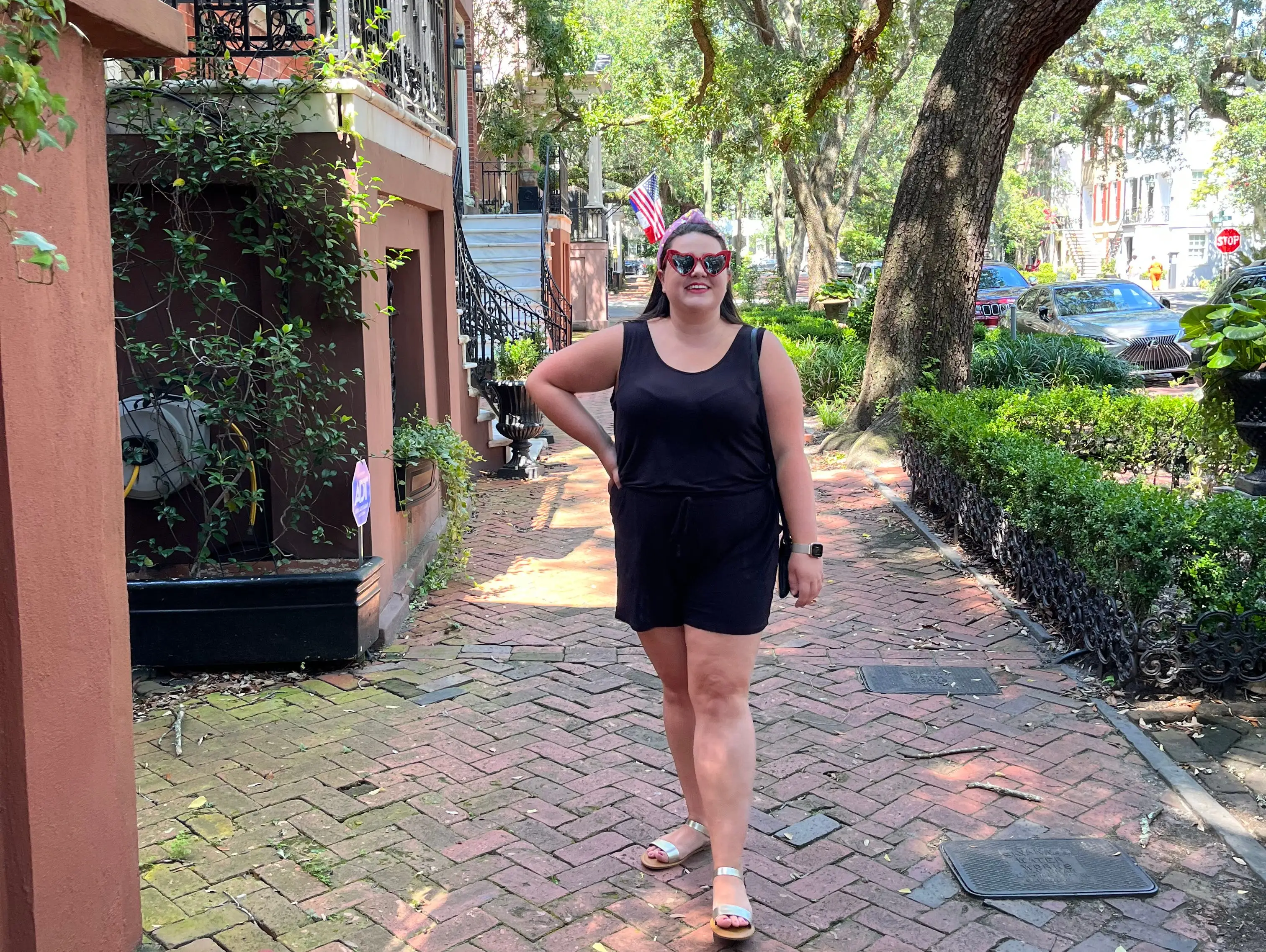 megan posing on a pretty tree lined street in savannah georgia