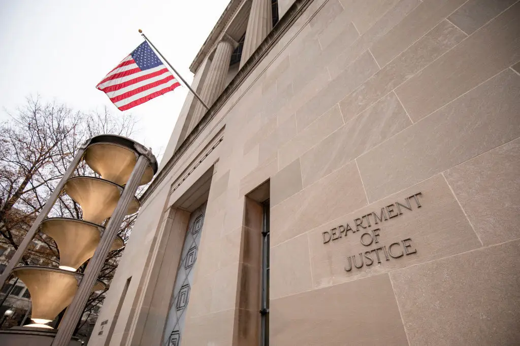 A flag waves outside the federal Department of Justice building in Washington, DC