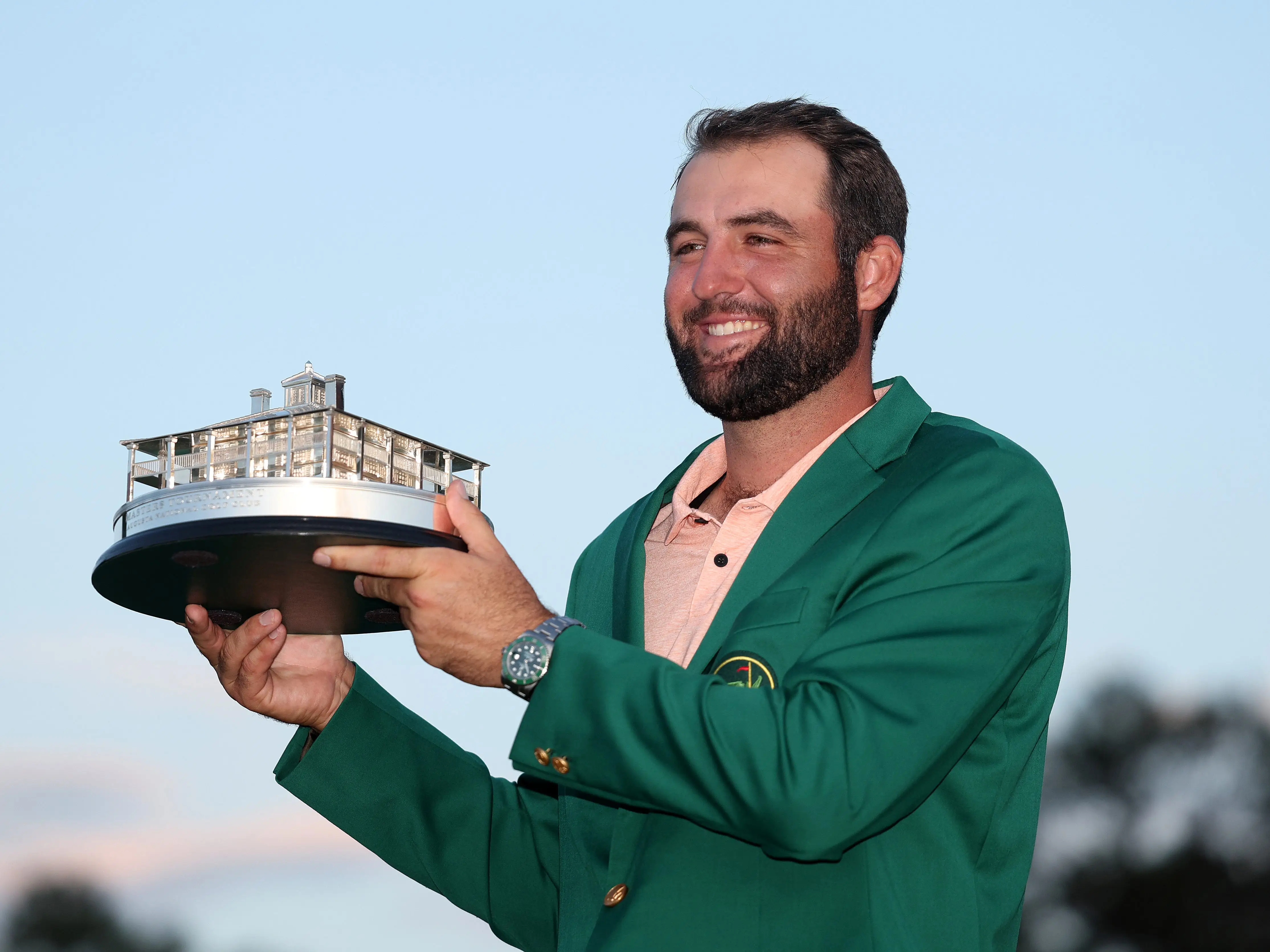 Scottie Scheffler holds up his trophy after his 2024 Masters win.