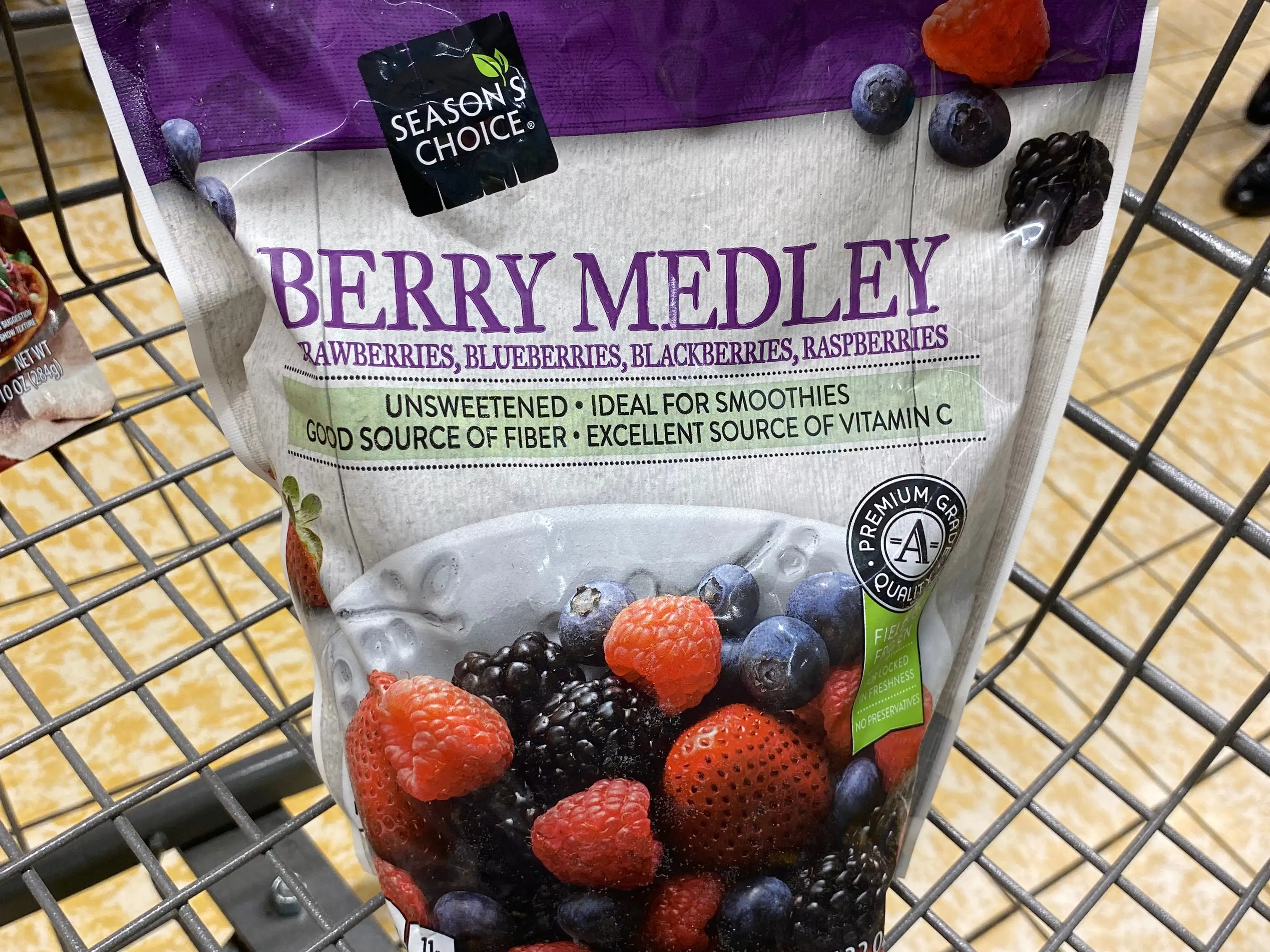 bag of frozen berries in a cart at aldi