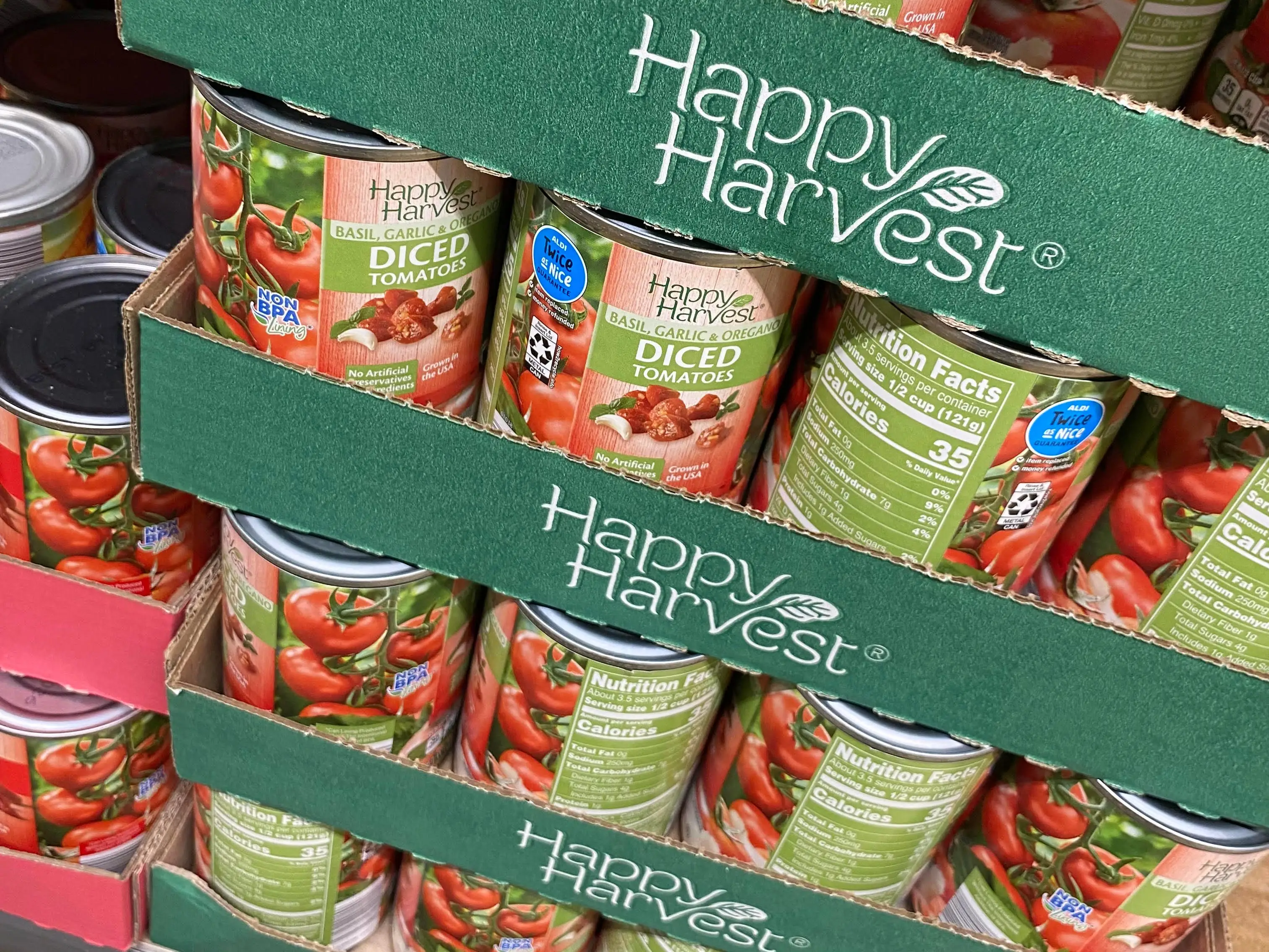 stacks of happy harvest canned tomatoes at aldi