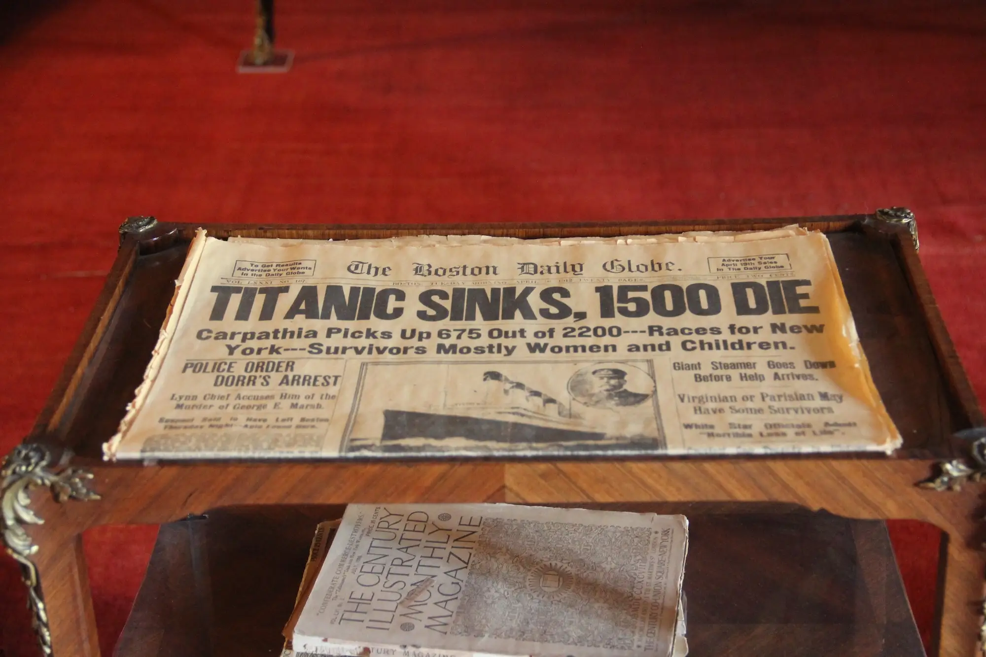 A newspaper with a headline about the Titanic sinking at Staatsburgh.