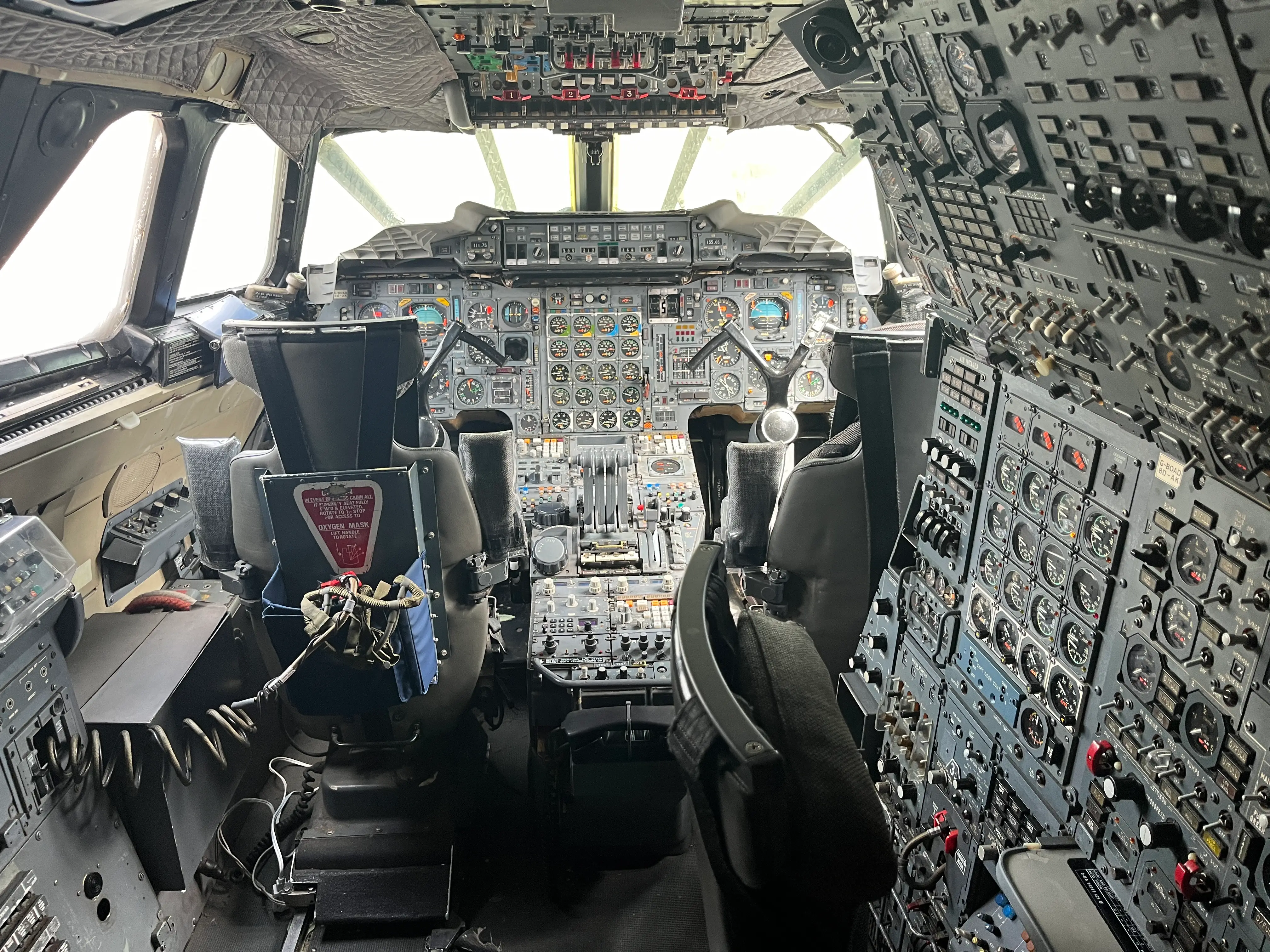 The cockpit of a plane, with countless dials and switches.
