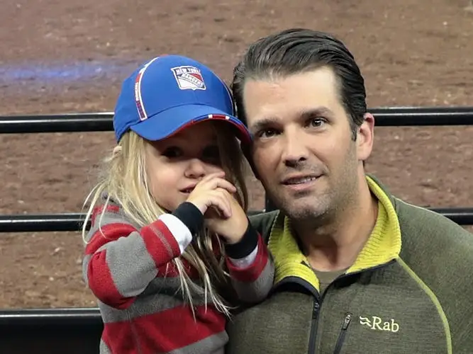 Donald Trump Jr. with his daughter Chloe Sophia Trump, who's wearing a cap.