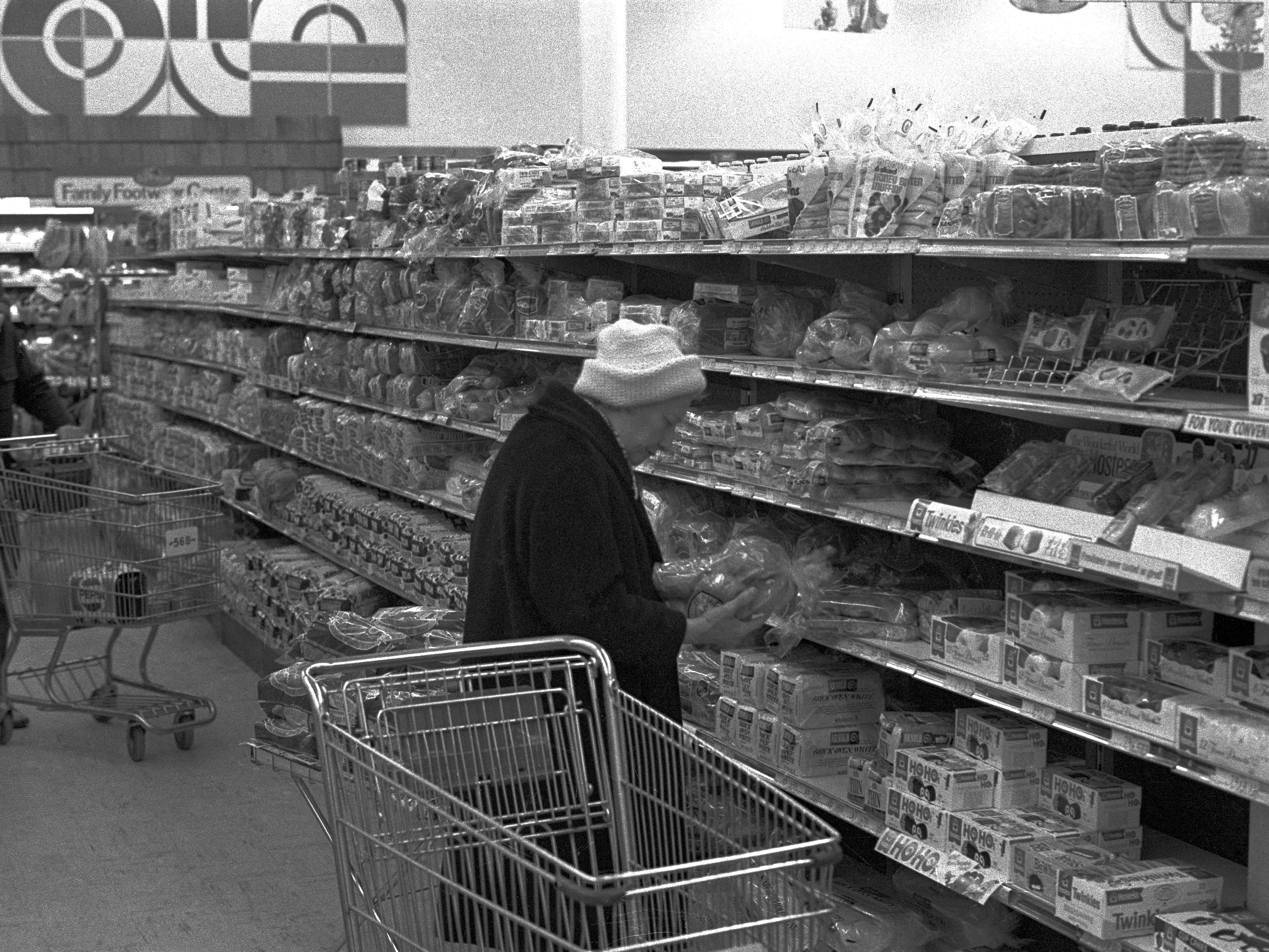 A woman looking at bread at a Maryland grocery store in 1978.