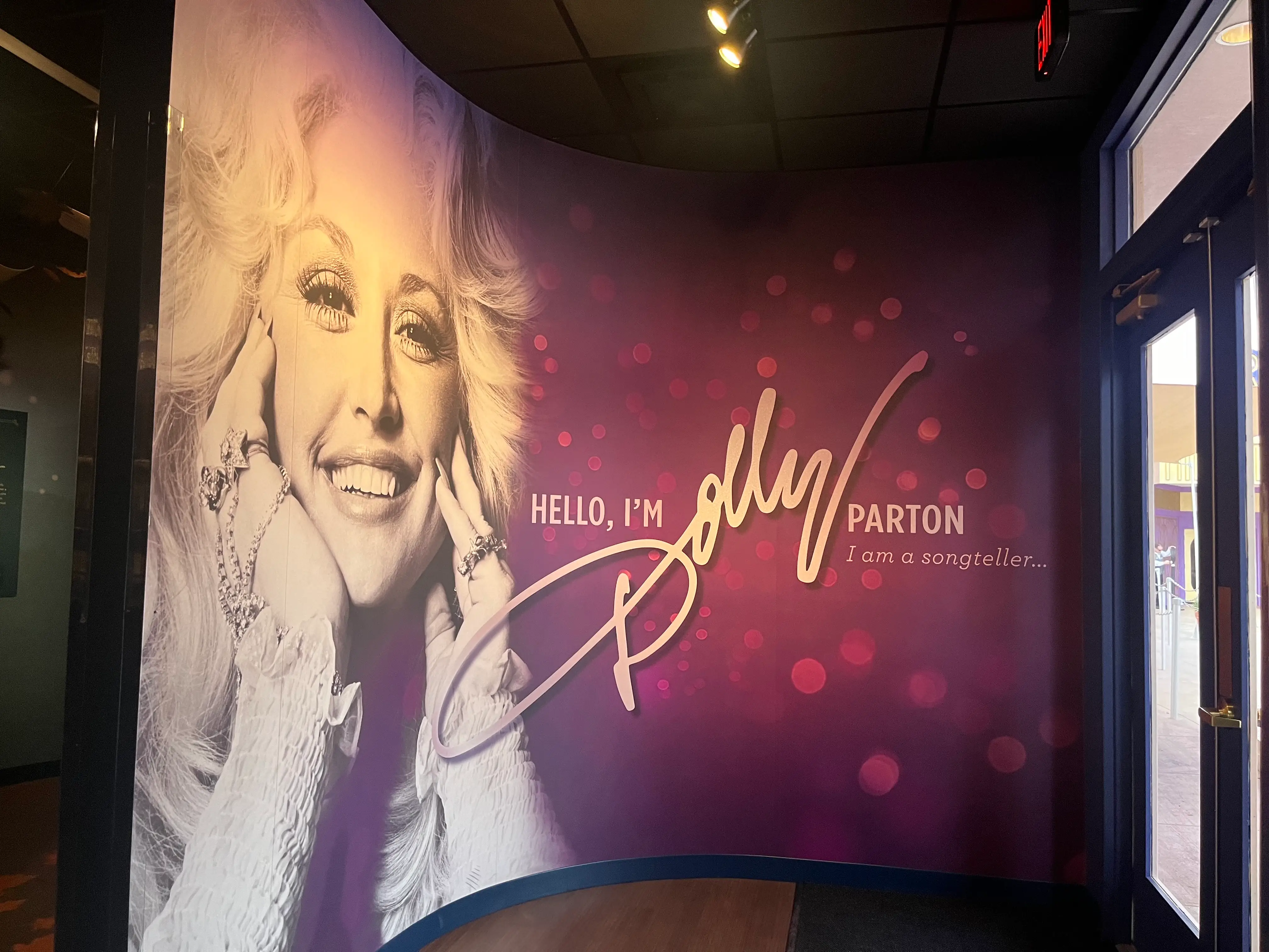 A display inside the Dolly Parton Experience, with a picture of Parton and text saying 