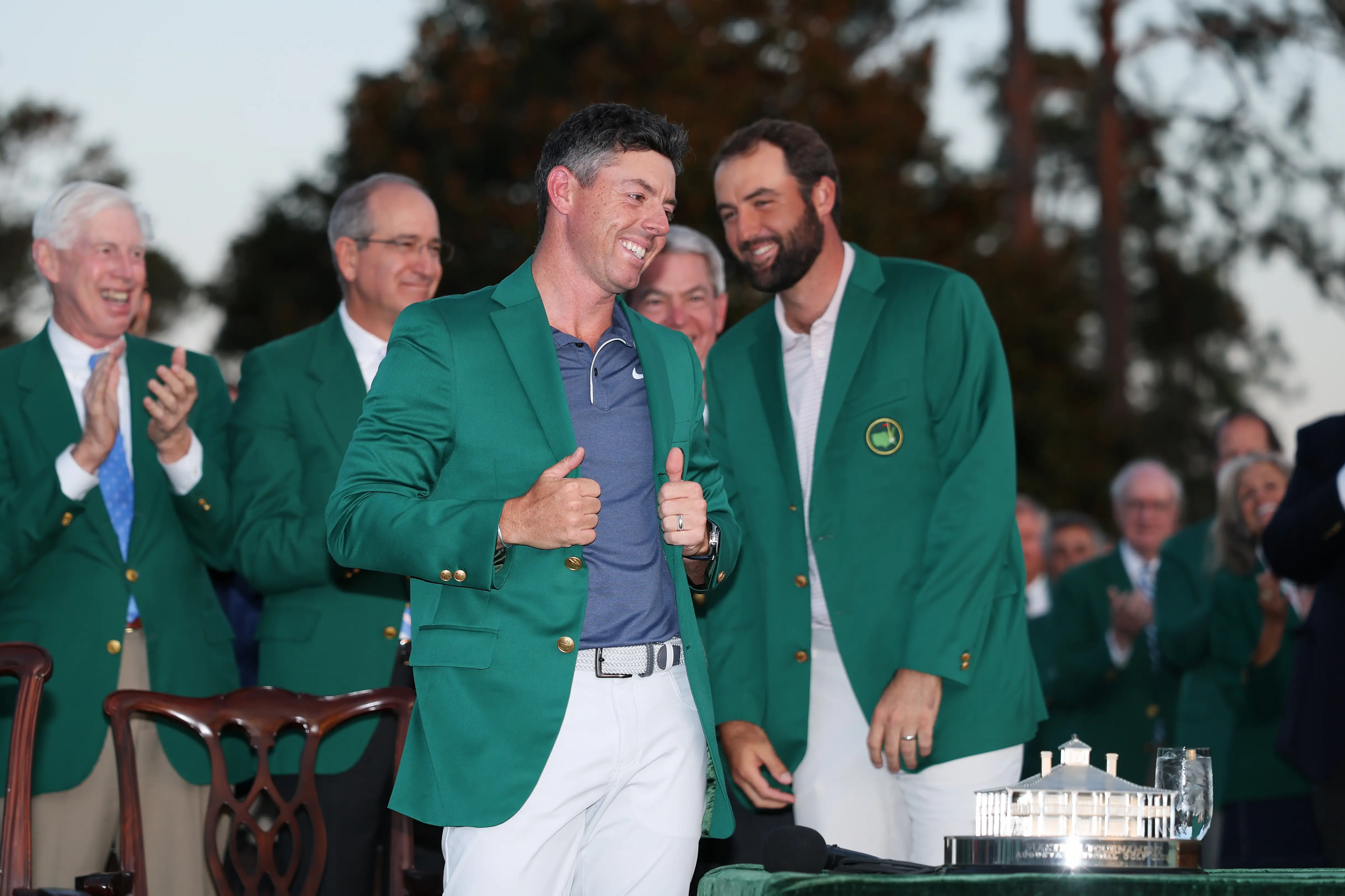 Rory McIlroy smiles as he wears his green jacket at the 2025 Masters Tournament.
