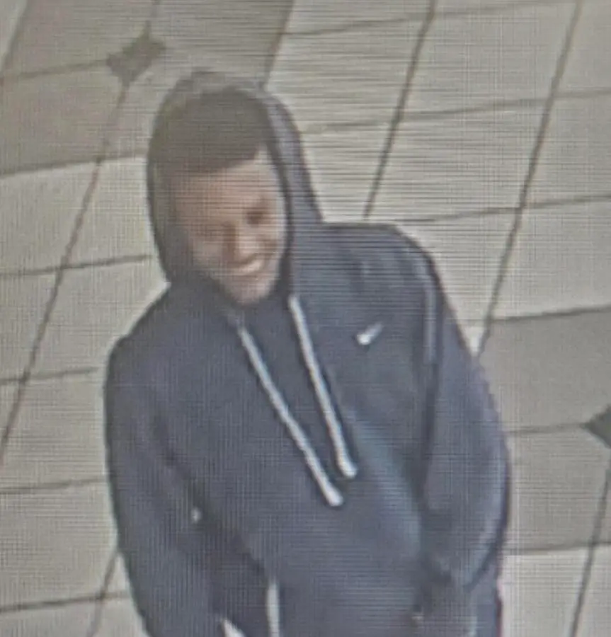 A person of interest wanted in the shooting was captured on security cameras inside the mall appears to be a black male wearing a blue hoodie.