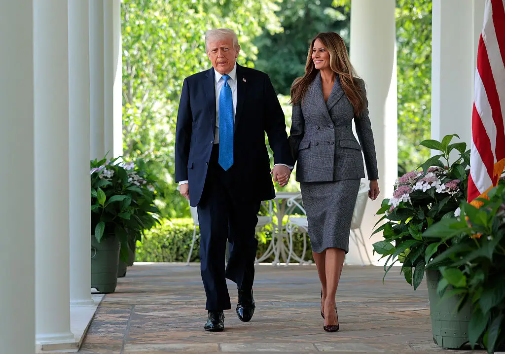 Donald Trump and Melania Trump arrive at the Rose Garden.