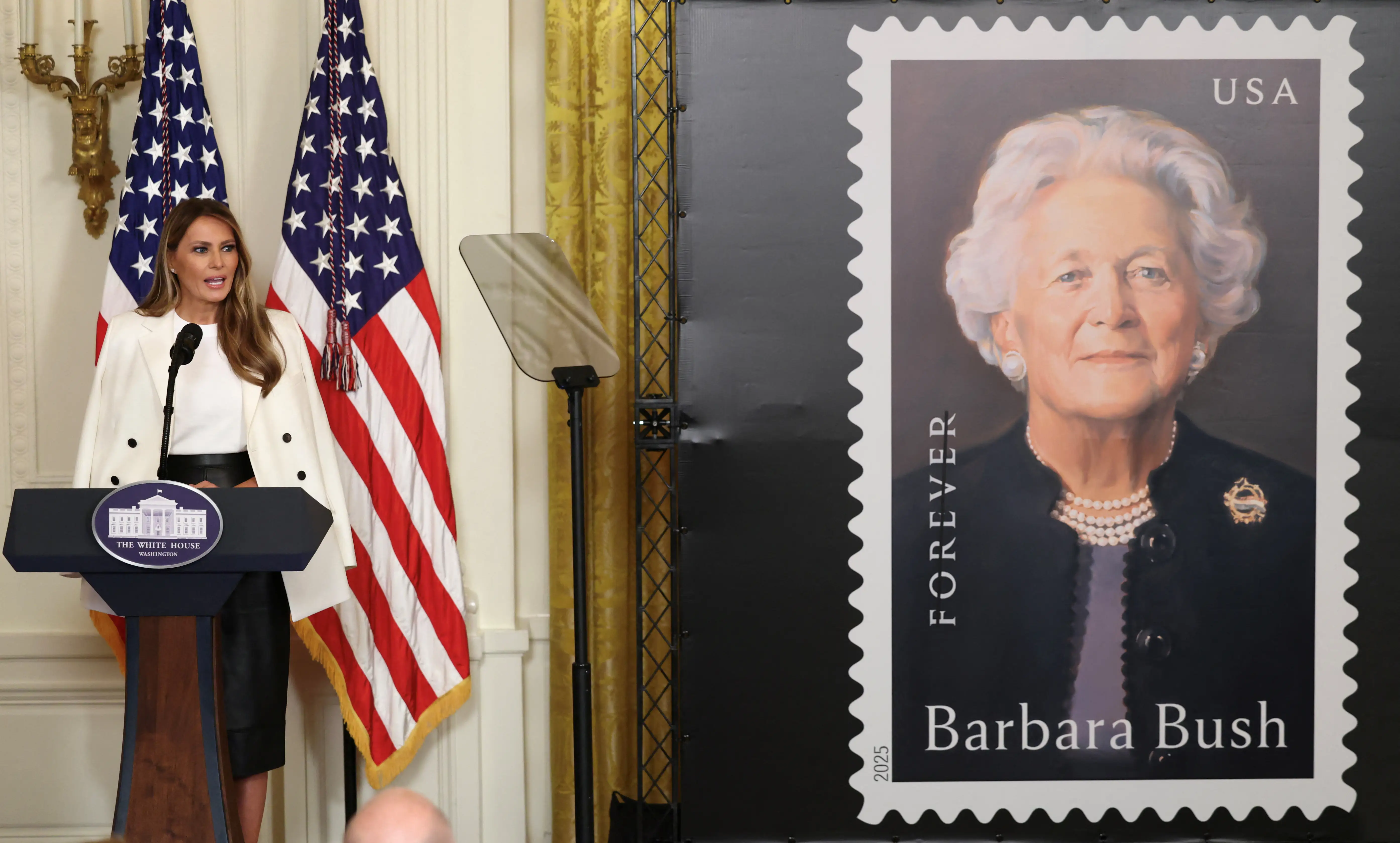 Melania Trump unveils a postage stamp of Barbara Bush at the White House.