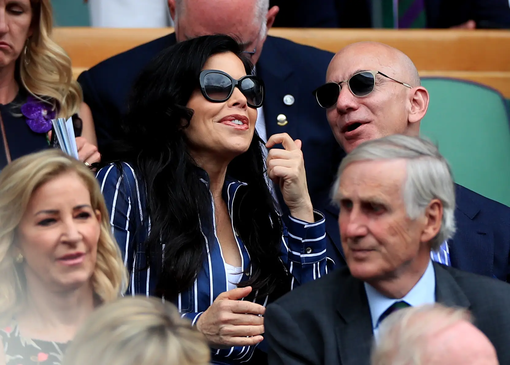 Lauren Sanchez and Jeff Bezos sit in the stands at Wimbledon.