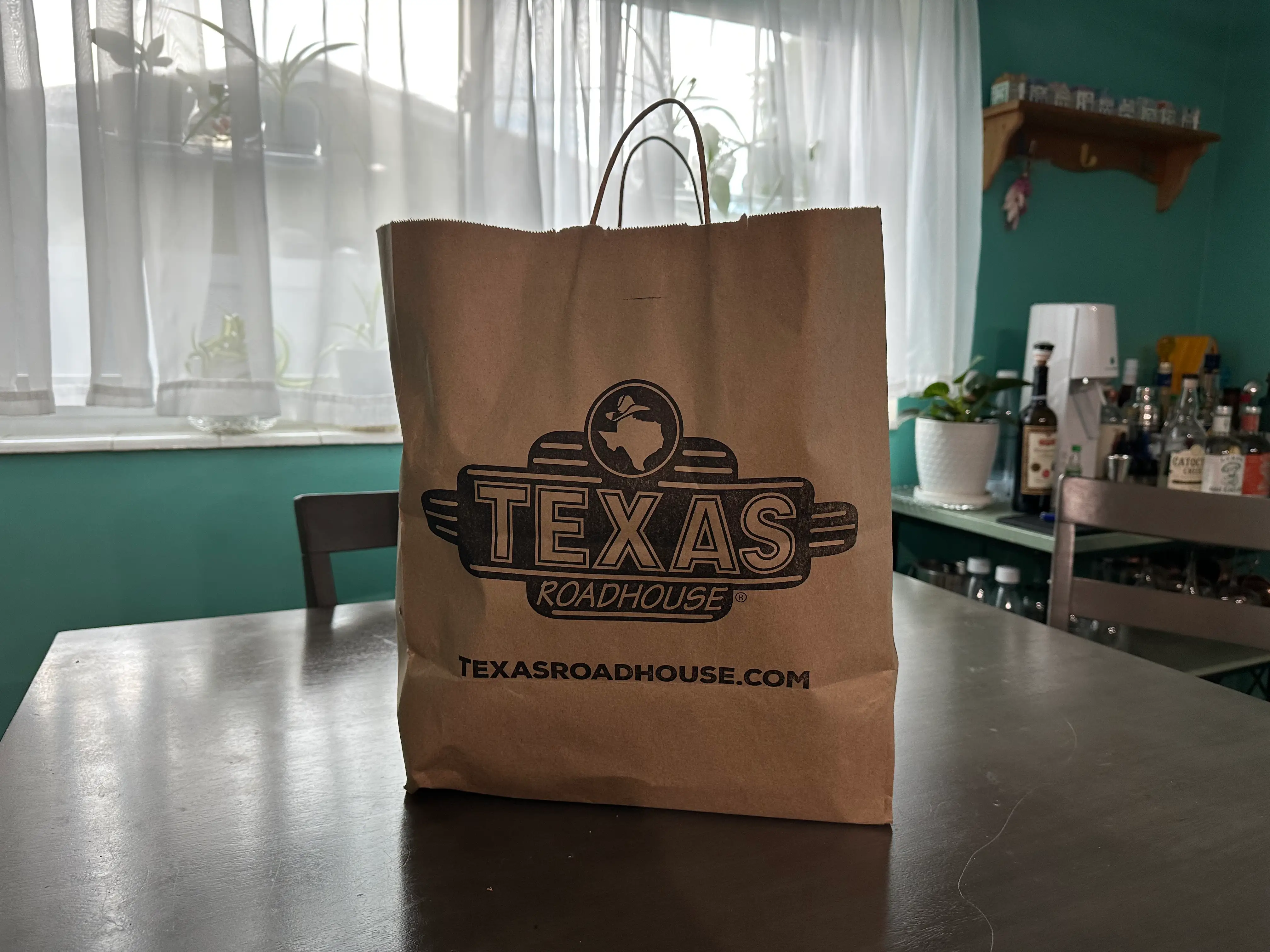 Texas Roadhouse bag on table