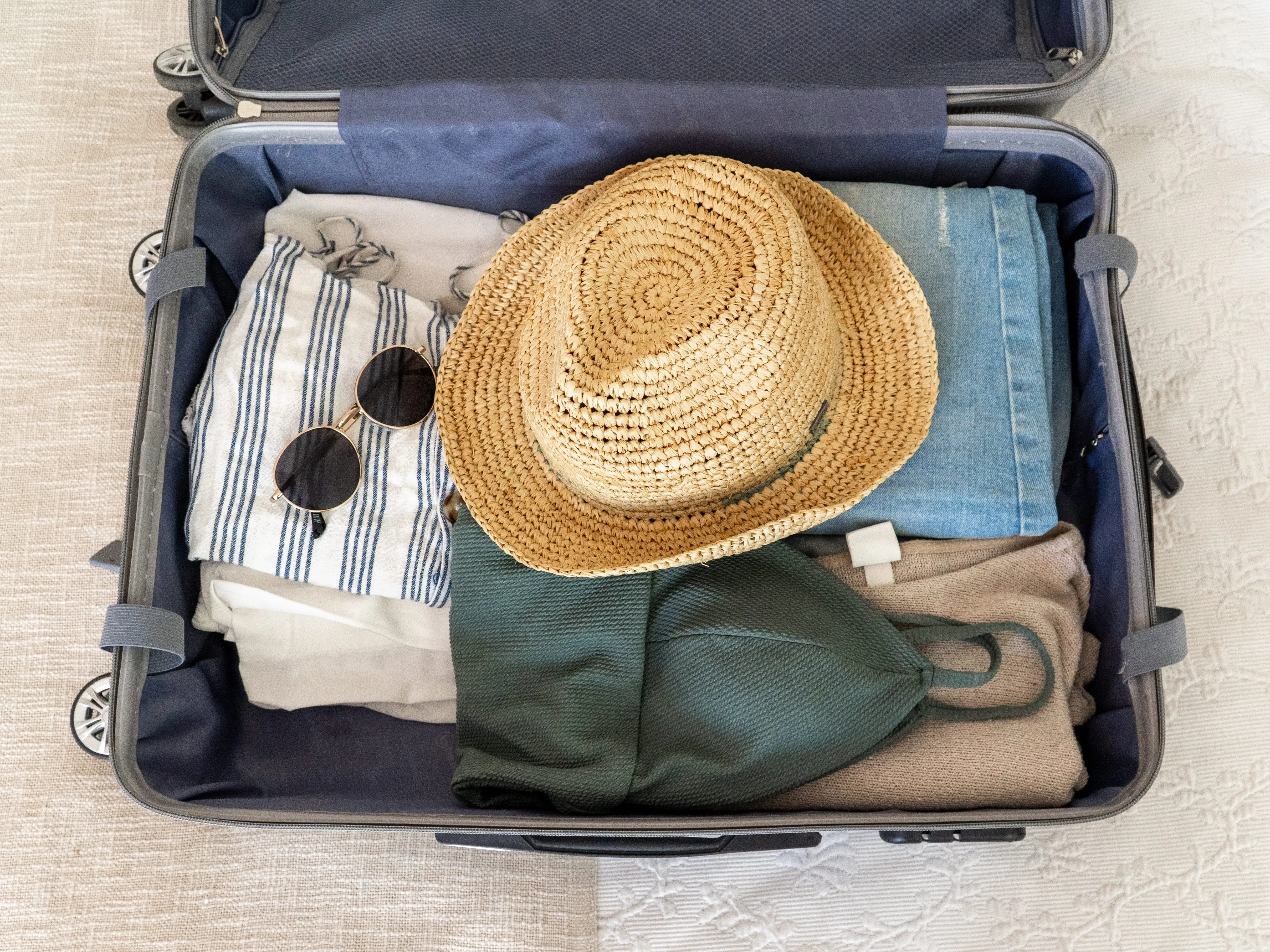 An open suitcase with clothes in it.