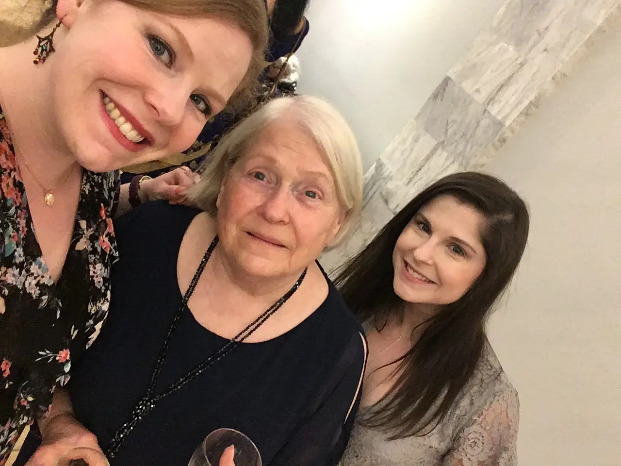 Three women smiling in a photo