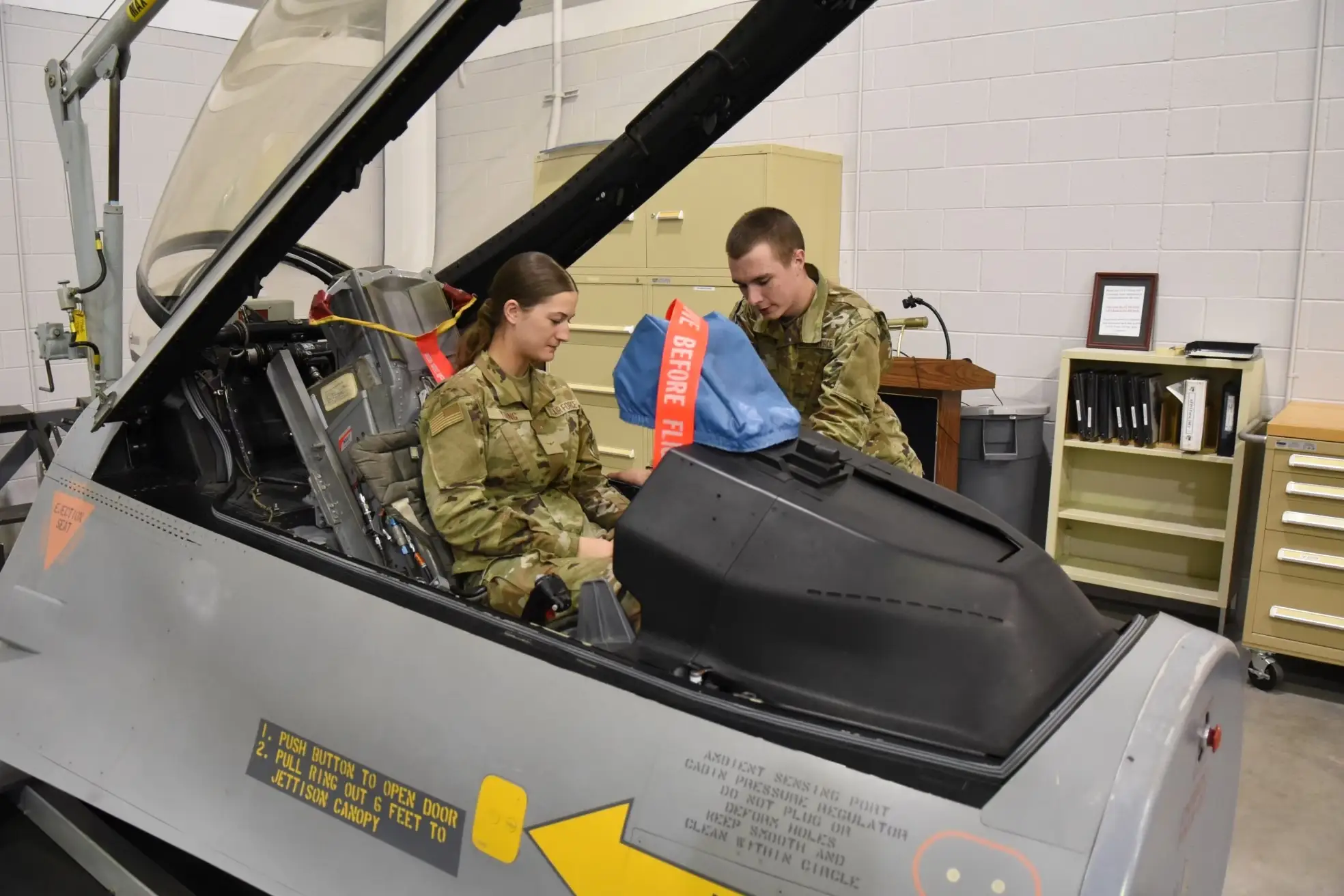 Airmen learn to properly adjust ejection seats in a course to ensure they're ready to use in an emergency.