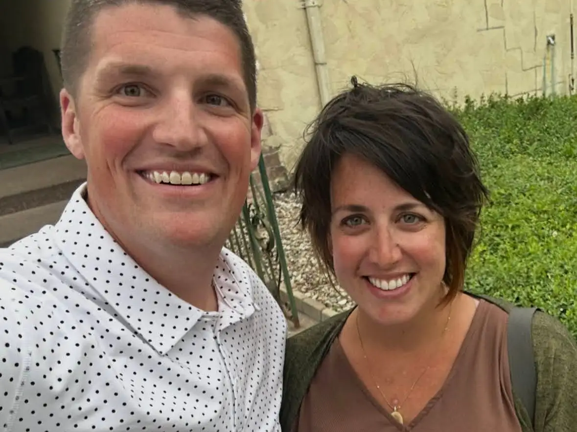 Man and woman smiling in selfie outside