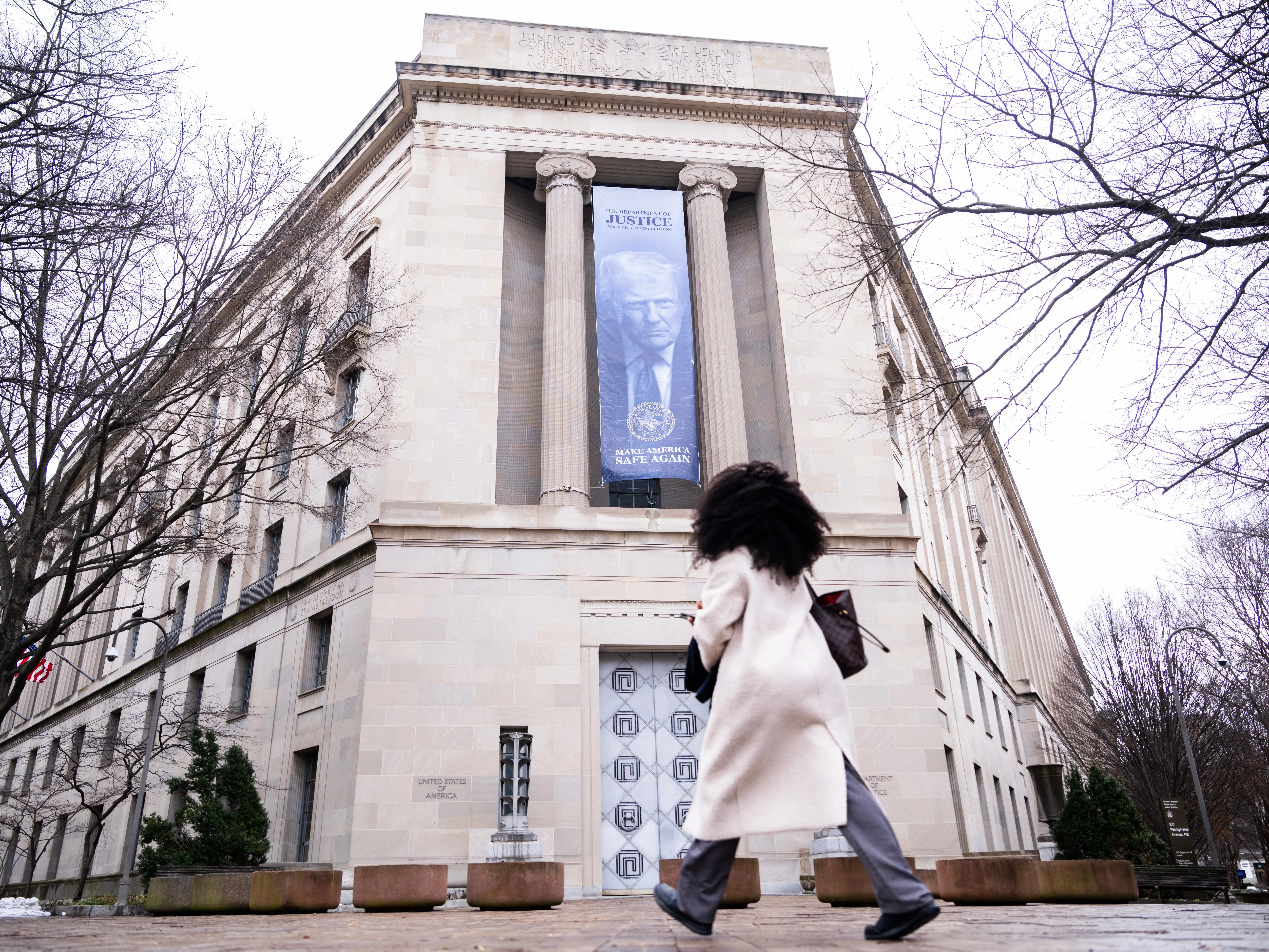 A President Donald Trump banner hangs along Pennsylvania Avenue, NW, on the Department of Justice building on Monday, February 23, 2026.