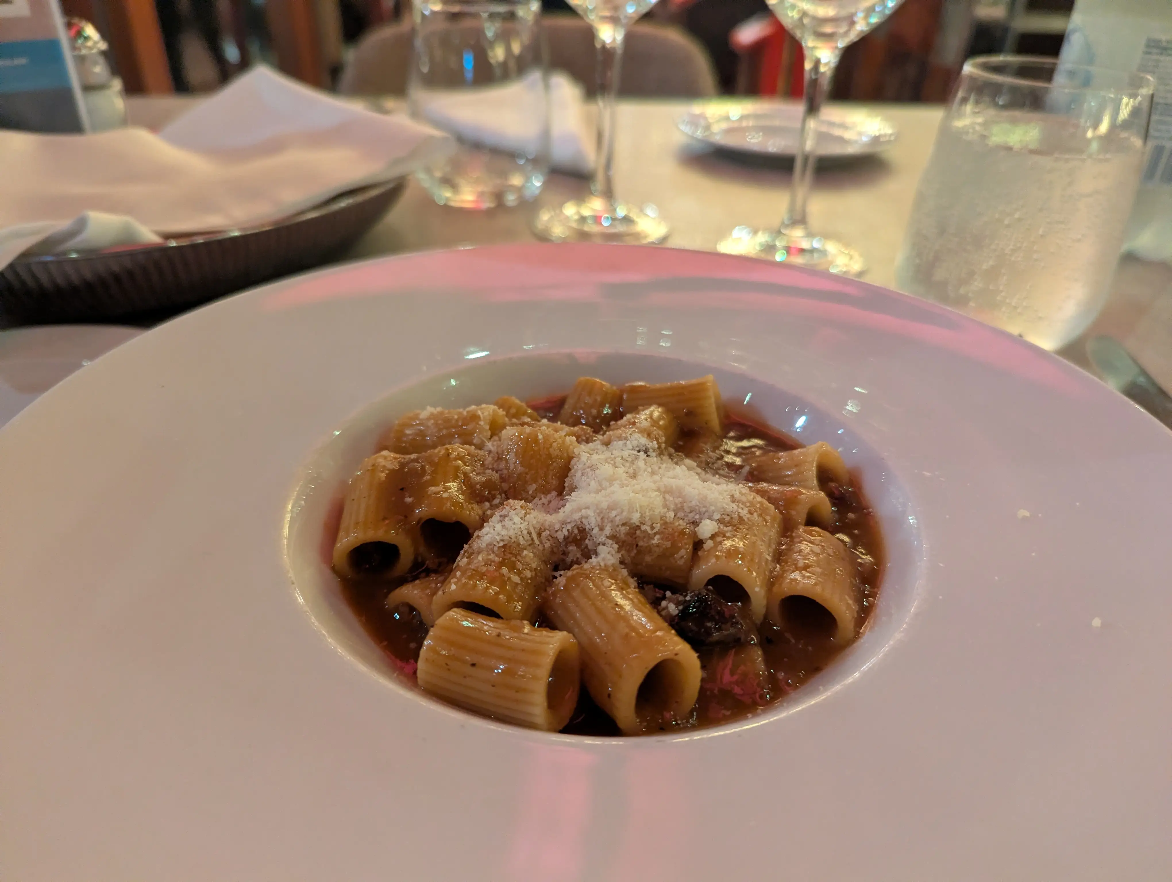 Pasta with parmesan cheese on top