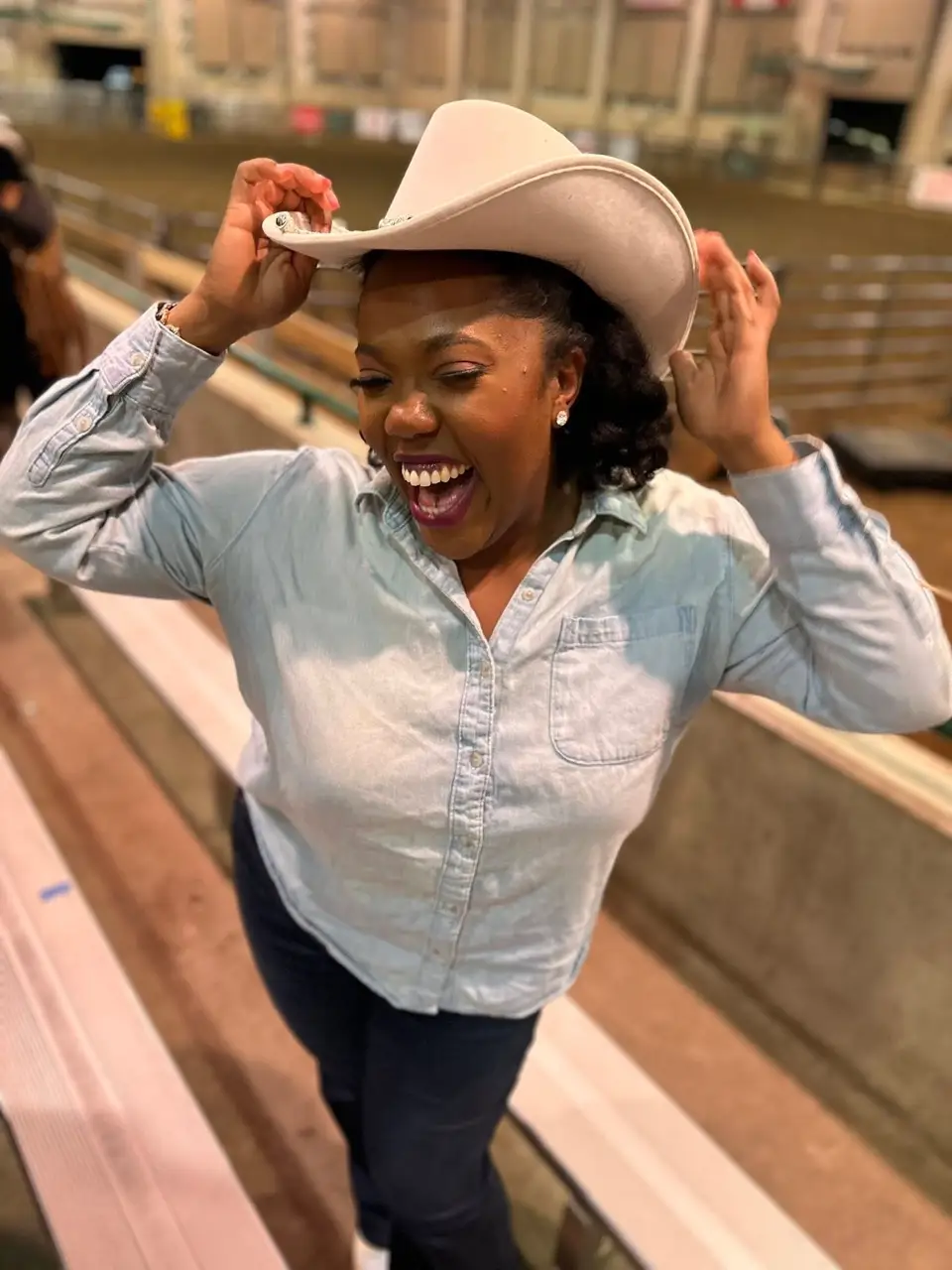 Woman smiling with cowboy hat on
