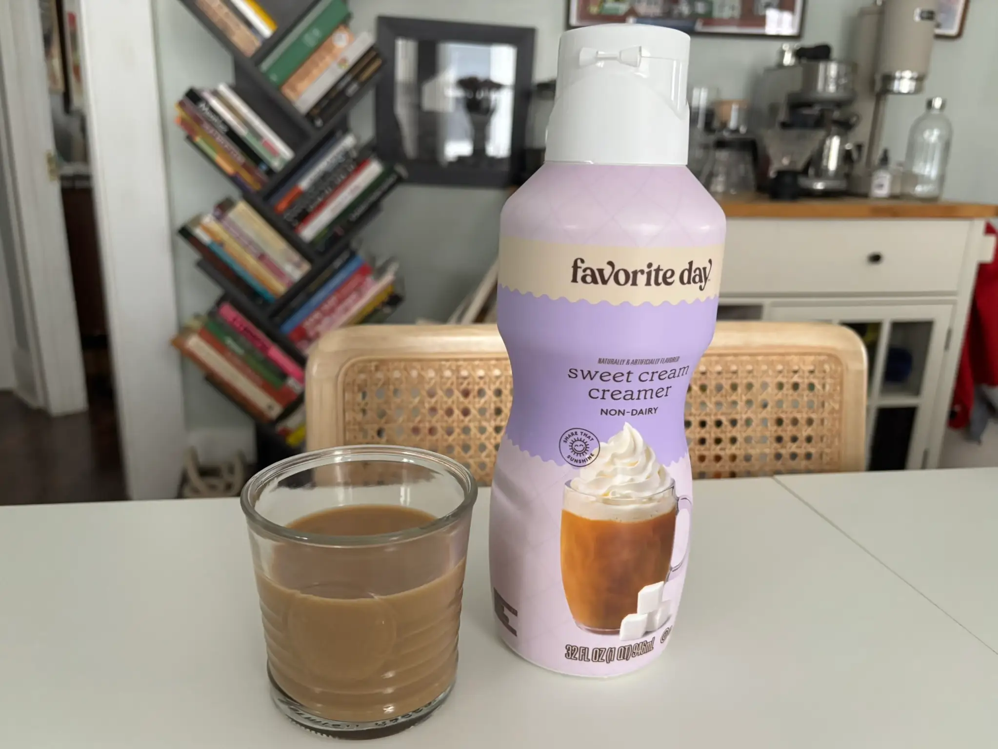 Favorite Day sweet-cream creamer next to cup of coffee with cream