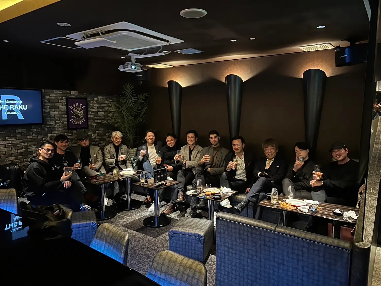 Group of men in suits at a bar in Japan.
