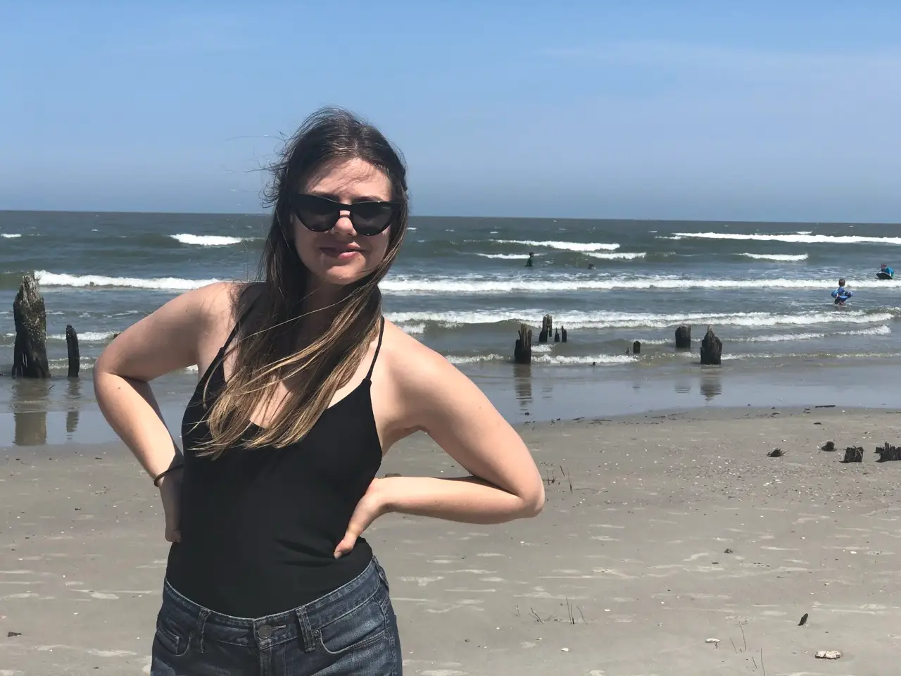 Woman smiling in sunglasses at Hunting Island State Park
